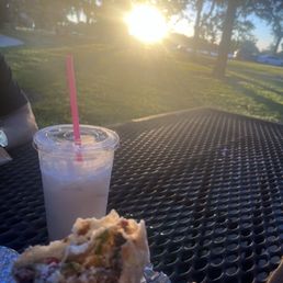 Carne asada supreme burrito with large horchata