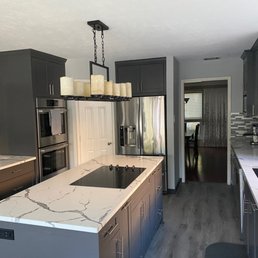 a kitchen with a marble countertop