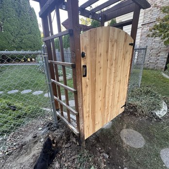 Rick's Custom Fencing & Decking - Custom wood gate installed in our existing arbor and chain link fencing to finish off the side yard. - Fences & Gates Near Me - Kennewick, Washington Rick's Custom Fencing & Decking - Custom wood gate installed in our existing arbor and chain link fencing to finish off the side yard. - Fences & Gates Near Me - Kennewick, Washington