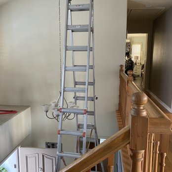Shining Light Electric - Hanging entry light - Electricians Near Me