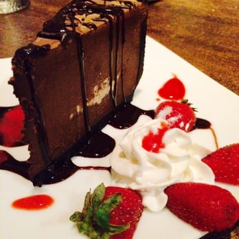 Sheila's Place - Chocolate kahlua mousse cake w raspberry sauce - New American Near Me - Camarillo, California Sheila's Place - Chocolate kahlua mousse cake w raspberry sauce - New American Near Me - Camarillo, California