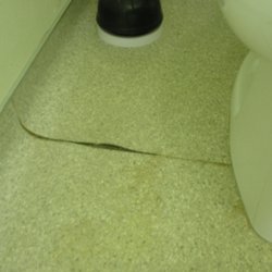 Claremont Collegiate Apartments - Close up of floor peeling off