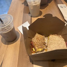 a sandwich in a box on a table a sandwich in a box on a table