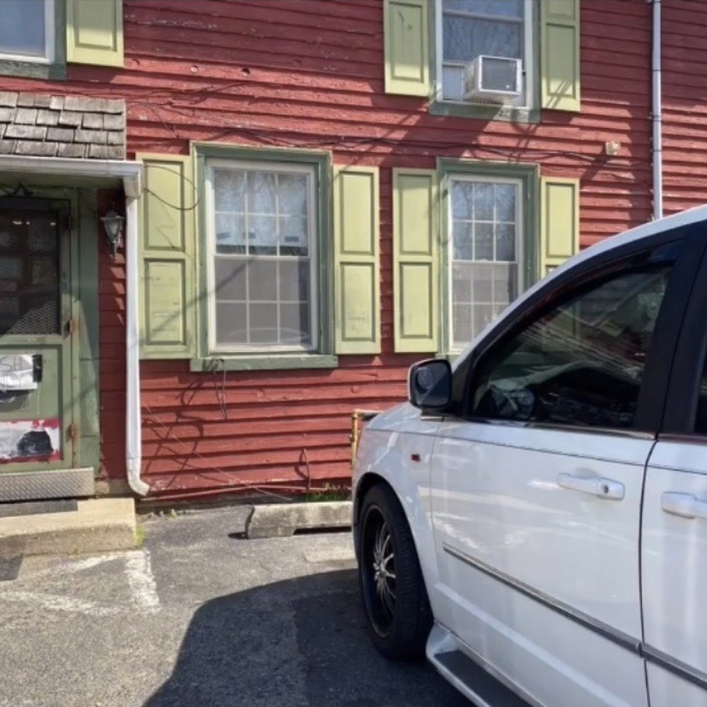 a car parked in front of it