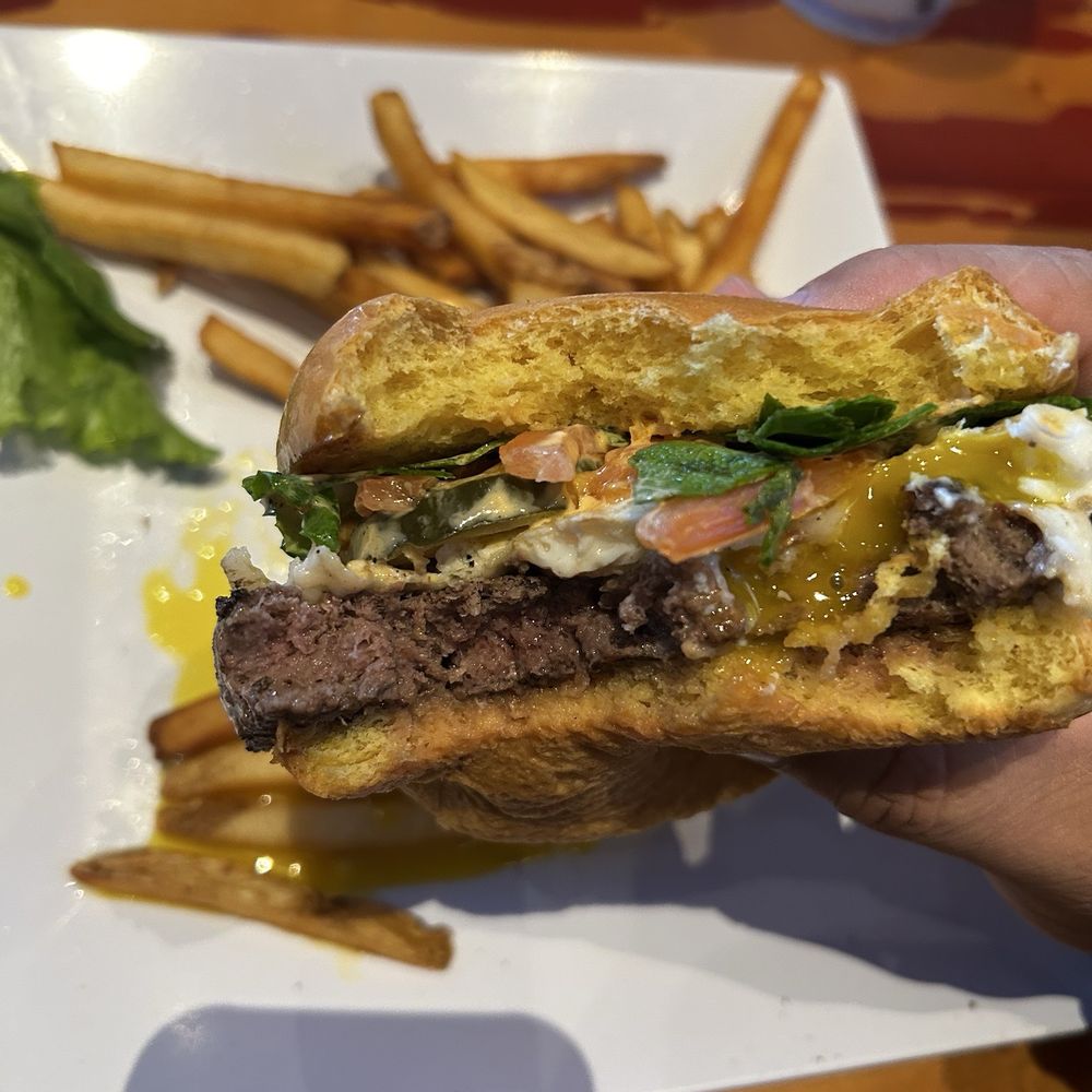 B&D Burgers - Build your own burger, Bison with provolone, fried egg, lettuce, tomato, pickle with bacon aioli on a brioche bun and home fries. - American Near Me - Pooler, Georgia B&D Burgers - Build your own burger, Bison with provolone, fried egg, lettuce, tomato, pickle with bacon aioli on a brioche bun and home fries. - American Near Me - Pooler, Georgia