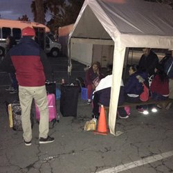 Tourismo Express - A picture of all of the people waiting- some people here have been waiting 2 hours. This is only 1 out of 3 groups waiting.