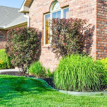 GAS Lawn Pros - a brick house with a lawn in front of it - Lawn Services Near Me - Liberal, Kansas