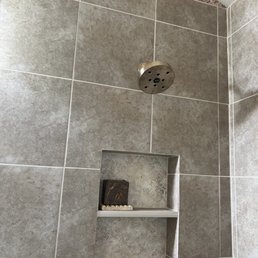 Lovely tile work with a large niche!