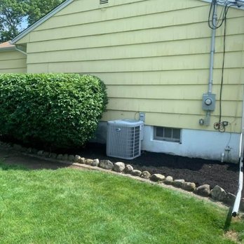 Kohle's Landscaping Services - an air conditioner outside a house - Landscaping Near Me