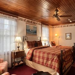 Palmer House Inn - The Samuel Clemens Room: two beds, room for three people, and a cheery, fun decorating theme. This room accepts dogs.