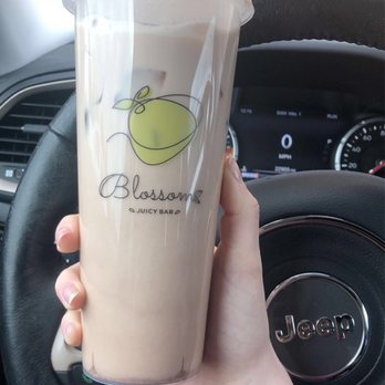 Blossom Juicy Bar - a hand holding a cup of iced coffee - Bubble Tea Near Me - Kettering, Ohio Blossom Juicy Bar - a hand holding a cup of iced coffee - Bubble Tea Near Me - Kettering, Ohio