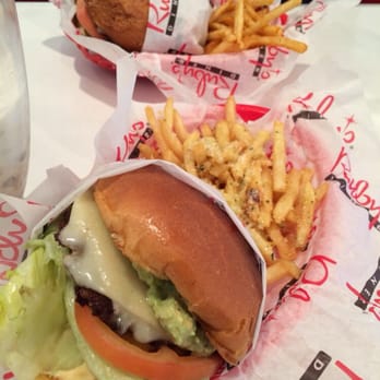 Ruby's Diner - My guacamole burger with garlic fries. Their caliente turkey burger on gluten free bun and Cajun fries. - Diners Near Me - Laguna Beach, California Ruby's Diner - My guacamole burger with garlic fries. Their caliente turkey burger on gluten free bun and Cajun fries. - Diners Near Me - Laguna Beach, California