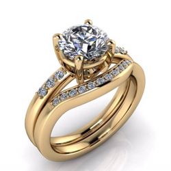 14k yellow gold wedding set designed for customer off computer images. 1.00 carat round, brilliant cut diamond in the center.
