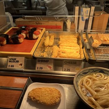 Marugame Udon - Bar area with spam masubi, tempura shrimp and gyoza - Japanese Near Me - Honolulu, Hawaii