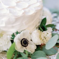 Beautiful, delicious, affordable wedding cake.  The frosting pattern was custom and live flowers were added by the wedding florist.  The s