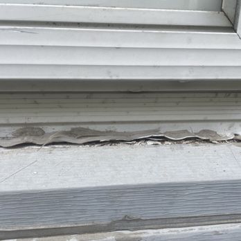 Arkansas Construction And Remodeling - damaged window trying to remove. - Roofing Near Me