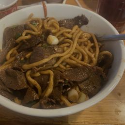Bowl of beef, green onions, and noodles. Bowl of beef, green onions, and noodles.