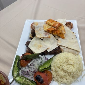 Almanjal Restaurant - Istanbul family meal with chicken, ribeye and Keftka kabobs. The bread is made in house. - Middle Eastern Near Me - Anaheim, California Almanjal Restaurant - Istanbul family meal with chicken, ribeye and Keftka kabobs. The bread is made in house. - Middle Eastern Near Me - Anaheim, California