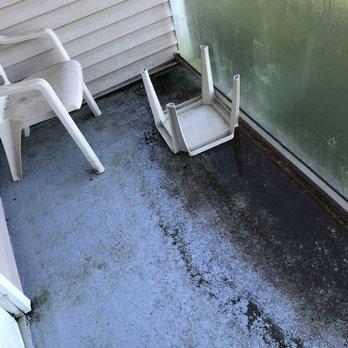 Shilo Inns Ocean Shores - Dirty balcony with flooding from rain with overturned table and algae and dirt on chair. This is how it looked when I checked in. - Hotels Near Me - Ocean Shores, Washington Shilo Inns Ocean Shores - Dirty balcony with flooding from rain with overturned table and algae and dirt on chair. This is how it looked when I checked in. - Hotels Near Me - Ocean Shores, Washington