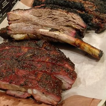 Killen's Barbecue - Pork Ribs up front, huge beef rib in the middle, and brisket in the back - Barbeque Near Me - Pearland, Texas Killen's Barbecue - Pork Ribs up front, huge beef rib in the middle, and brisket in the back - Barbeque Near Me - Pearland, Texas