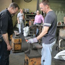 Virginia Institute of Blacksmithing - Instructor Dale (left) checking out tempering process.