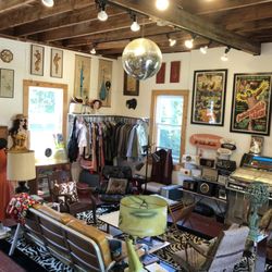Another view of the modern side of the store. A glimpse of our radio collection and our sci-fi movie posters and our '64Wurlitzer juke box.