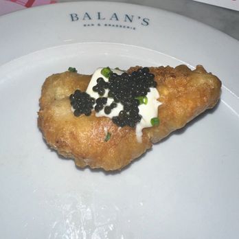 Balan's - Caviar and cream fraiche atop fried chicken - Cocktail Bars Near Me - Miami, Florida Balan's - Caviar and cream fraiche atop fried chicken - Cocktail Bars Near Me - Miami, Florida