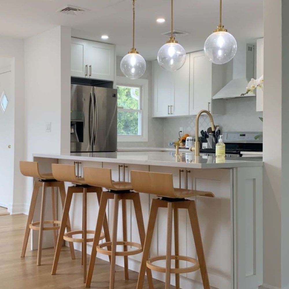 Jav Home Automation - a kitchen with bar stools - Home Automation Near Me - Queens, New York Jav Home Automation - a kitchen with bar stools - Home Automation Near Me - Queens, New York