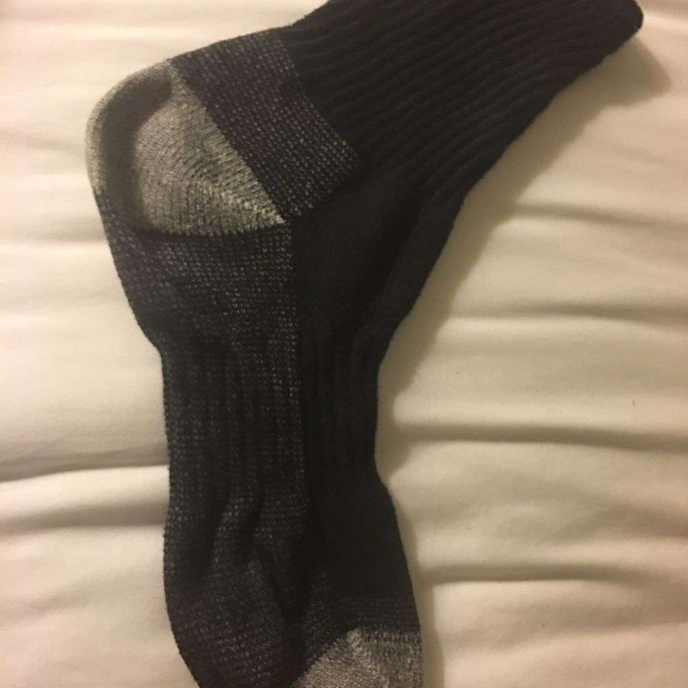 Sock Tavern - a pair of socks on a bed - New American Near Me - Williamsport, Pennsylvania Sock Tavern - a pair of socks on a bed - New American Near Me - Williamsport, Pennsylvania