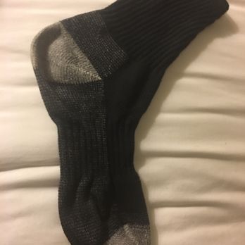 Sock Tavern - a pair of socks on a bed - New American Near Me - Williamsport, Pennsylvania Sock Tavern - a pair of socks on a bed - New American Near Me - Williamsport, Pennsylvania