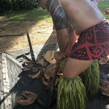 Toa Luau - Taking the husks off of the coconuts - Cultural Center Near Me - Haleiwa, Hawaii Toa Luau - Taking the husks off of the coconuts - Cultural Center Near Me - Haleiwa, Hawaii