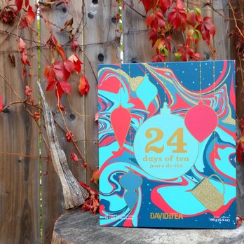 DAVIDsTEA - a book on a tree stump in front of a fence - Tea Rooms Near Me - Edmonton, Alberta DAVIDsTEA - a book on a tree stump in front of a fence - Tea Rooms Near Me - Edmonton, Alberta