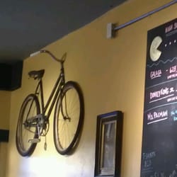 Spokeasy Public House - Bicycle emerging from the wall.