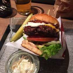 London New York - Burger with horse radish dressing and some bacon added to it. Comes with slaw and w added some sweet potato fries. 180 grams of happiness.