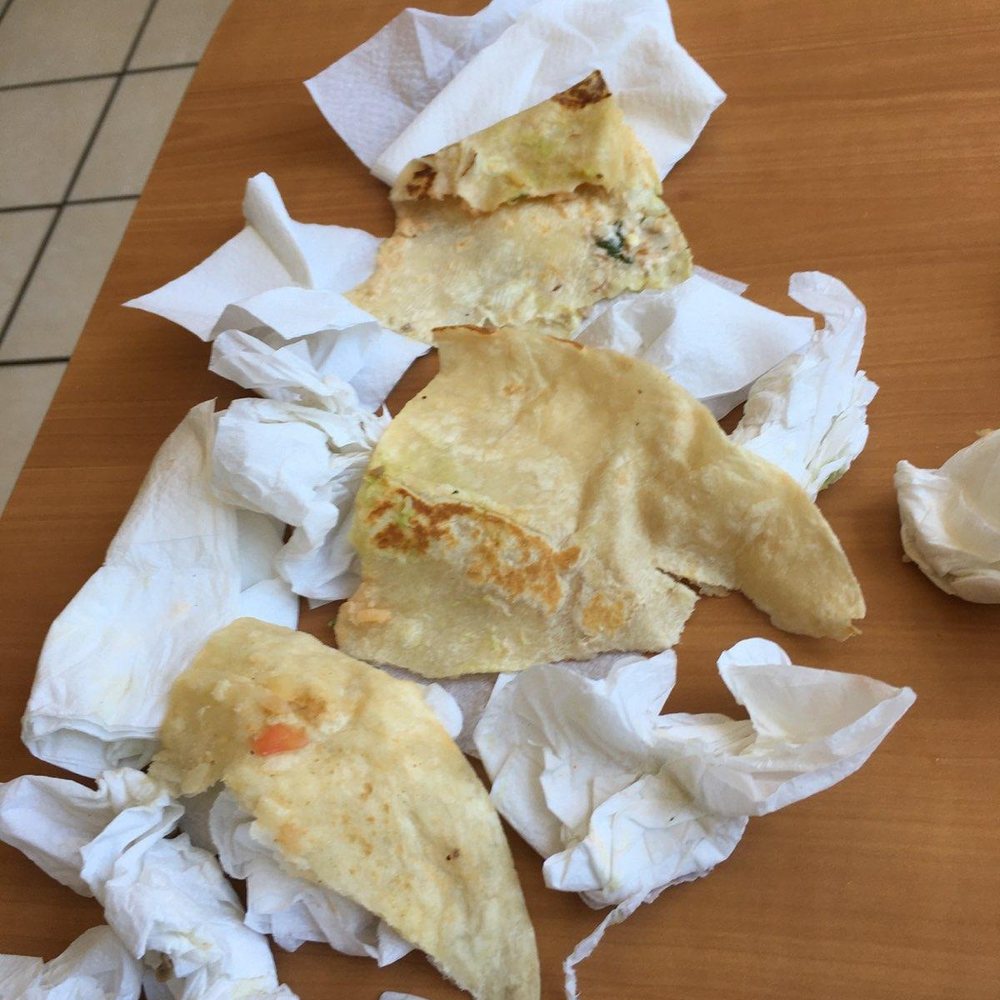 Taqueria Los Gordos - Tortilla I cut out of the burrito placed on napkins to show how big the pieces were. Also didn't want to dirty their table. - Mexican Near Me - Aptos, California Taqueria Los Gordos - Tortilla I cut out of the burrito placed on napkins to show how big the pieces were. Also didn't want to dirty their table. - Mexican Near Me - Aptos, California