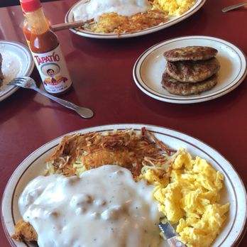 Rooster's - Rooster 's Chicken Fried Steak breakfast. Split on two plates with a side of Three Sausage Patty. - American Near Me - Medford, Oregon Rooster's - Rooster 's Chicken Fried Steak breakfast. Split on two plates with a side of Three Sausage Patty. - American Near Me - Medford, Oregon