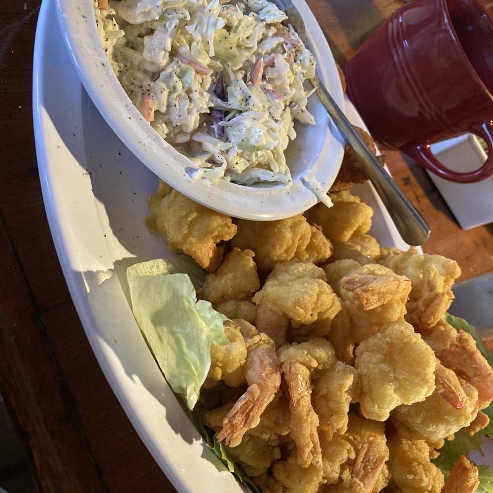 The Shrimp Platter served with two sides.  I chose double Cole Slaw. The mound of delicious local shrimp is amazing. Hush puppies perfect.