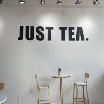 Top Tea - a table and chairs in front of a sign that says just tea - Bubble Tea Near Me - Halifax, Nova Scotia Top Tea - a table and chairs in front of a sign that says just tea - Bubble Tea Near Me - Halifax, Nova Scotia