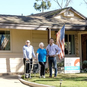 Sunlife Solar and Roofing - Great Customers Ann & Dave Axelson with Arthur after their 6.67KW solar installation. - Solar Installation Near Me - Irvine, California Sunlife Solar and Roofing - Great Customers Ann & Dave Axelson with Arthur after their 6.67KW solar installation. - Solar Installation Near Me - Irvine, California