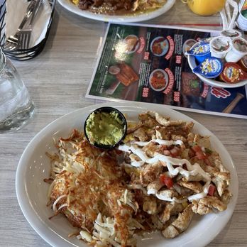 Loaded Cafe - Asada Chilaquiles Chicken Guacamole Stacker - Breakfast & Brunch Near Me - Gardena, California Loaded Cafe - Asada Chilaquiles Chicken Guacamole Stacker - Breakfast & Brunch Near Me - Gardena, California