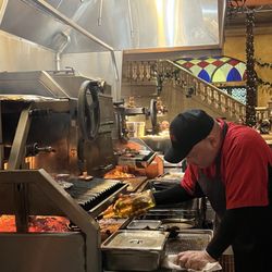 Cuba Libre Restaurant & Rum Bar - Seasoning the meats