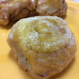 A decadent cinnamon roll drizzling with deliciousness