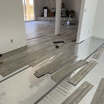 Dignity Floors and More - This shows the underlayment Norm recommended. It helps soften your step/dampen the sound so it doesn't sound like you're stomping everywhere - Flooring Near Me