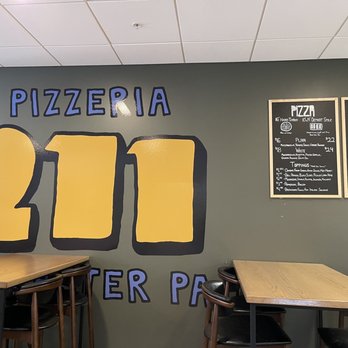 Pizzeria 211 - tables and chairs in a restaurant - Cheesesteaks Near Me - Lancaster, Pennsylvania