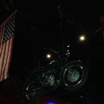 The Roadhouse - There are 3 vintage Harleys suspended from the ceiling and the flag of the U.S.A. - American Near Me - Cave Creek, Arizona The Roadhouse - There are 3 vintage Harleys suspended from the ceiling and the flag of the U.S.A. - American Near Me - Cave Creek, Arizona