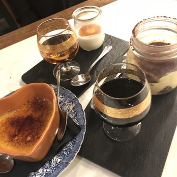 Dilla - Left to right: crème brûlée, Panna Cotta with apple brandy, and tiramisu with coffee liqueur - Italian Near Me - Rome, RM Dilla - Left to right: crème brûlée, Panna Cotta with apple brandy, and tiramisu with coffee liqueur - Italian Near Me - Rome, RM