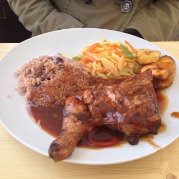 Patrick's Stop - Half portion of the jerk chicken, with rice & beans, a sweet slaw, and fried plantains (the three sides come with all the meals). - Caribbean Near Me - Stuttgart, BW