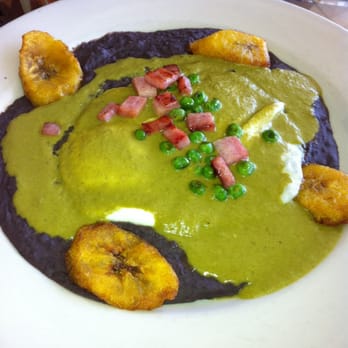 Sazón - Huevos Montulenos: black beans, eggs, special order Pipian sauce, ham, peas, and plantains - Mexican Near Me - Austin, Texas Sazón - Huevos Montulenos: black beans, eggs, special order Pipian sauce, ham, peas, and plantains - Mexican Near Me - Austin, Texas