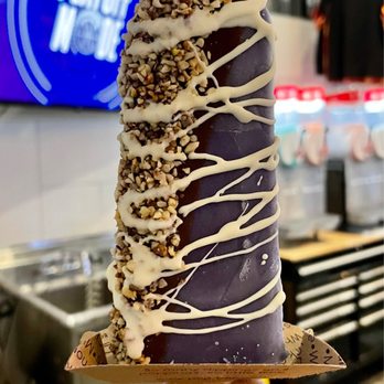 Popbar - a hand holding a chocolate covered ice cream cone - Ice Cream & Frozen Yogurt Near Me - Rancho Cucamonga, California
