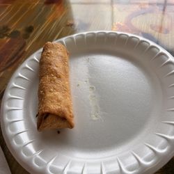 Evergreen Chinese Restaurant - Steaming hot eggroll that just came out of the fryer placed on a Styrofoam plate. The plate was melting from the heat.